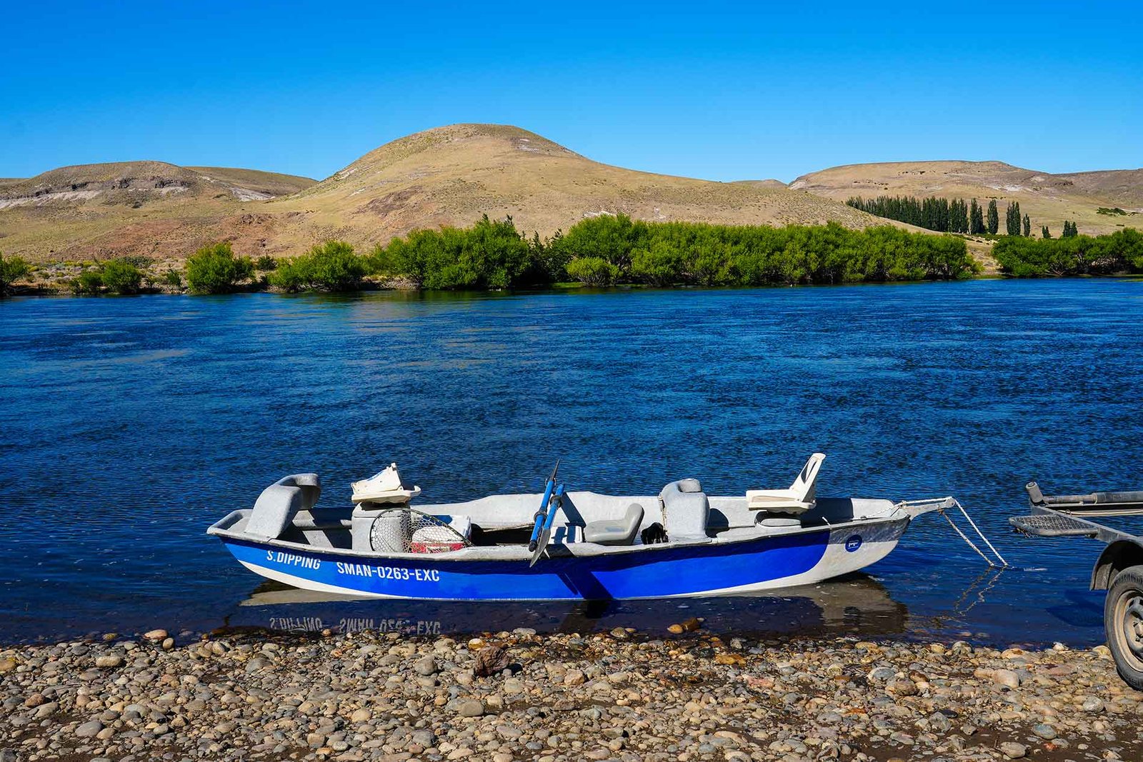 fishing rowboat on a patagonian river
