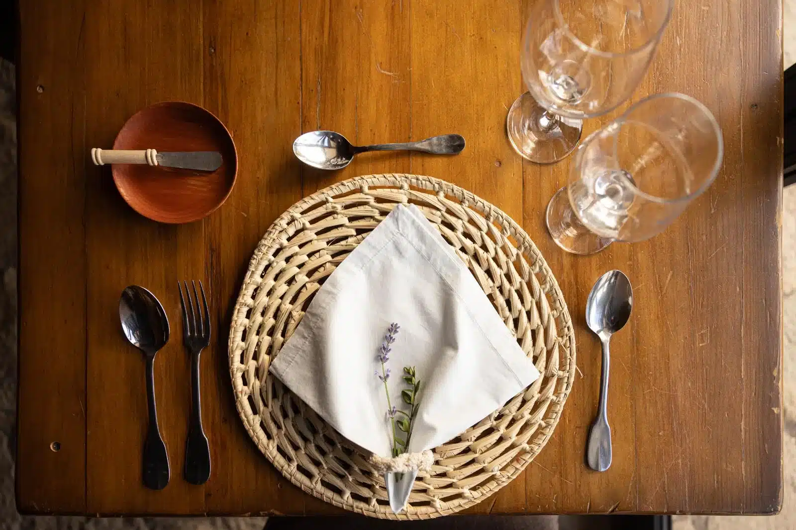 A place setting from above with a white napkin and lavender at River House Lodge, Patagonia